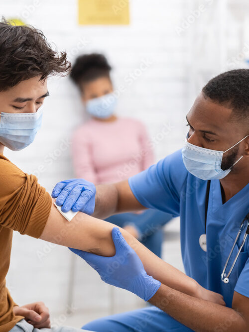 black doctor with patient